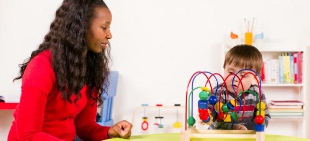 Teacher and child playing